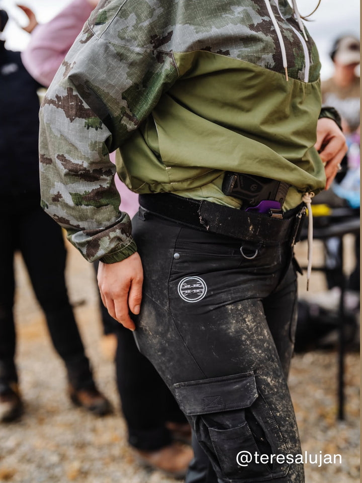 Betty 2.0 IWB holster carried inside the waistband at the hip under a jacket, worn at the range