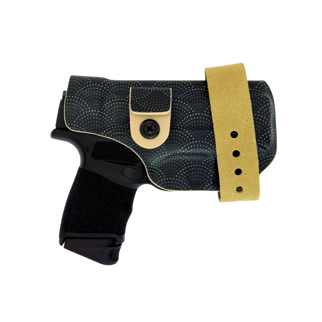 Black gun holster with gold strap on a white background
