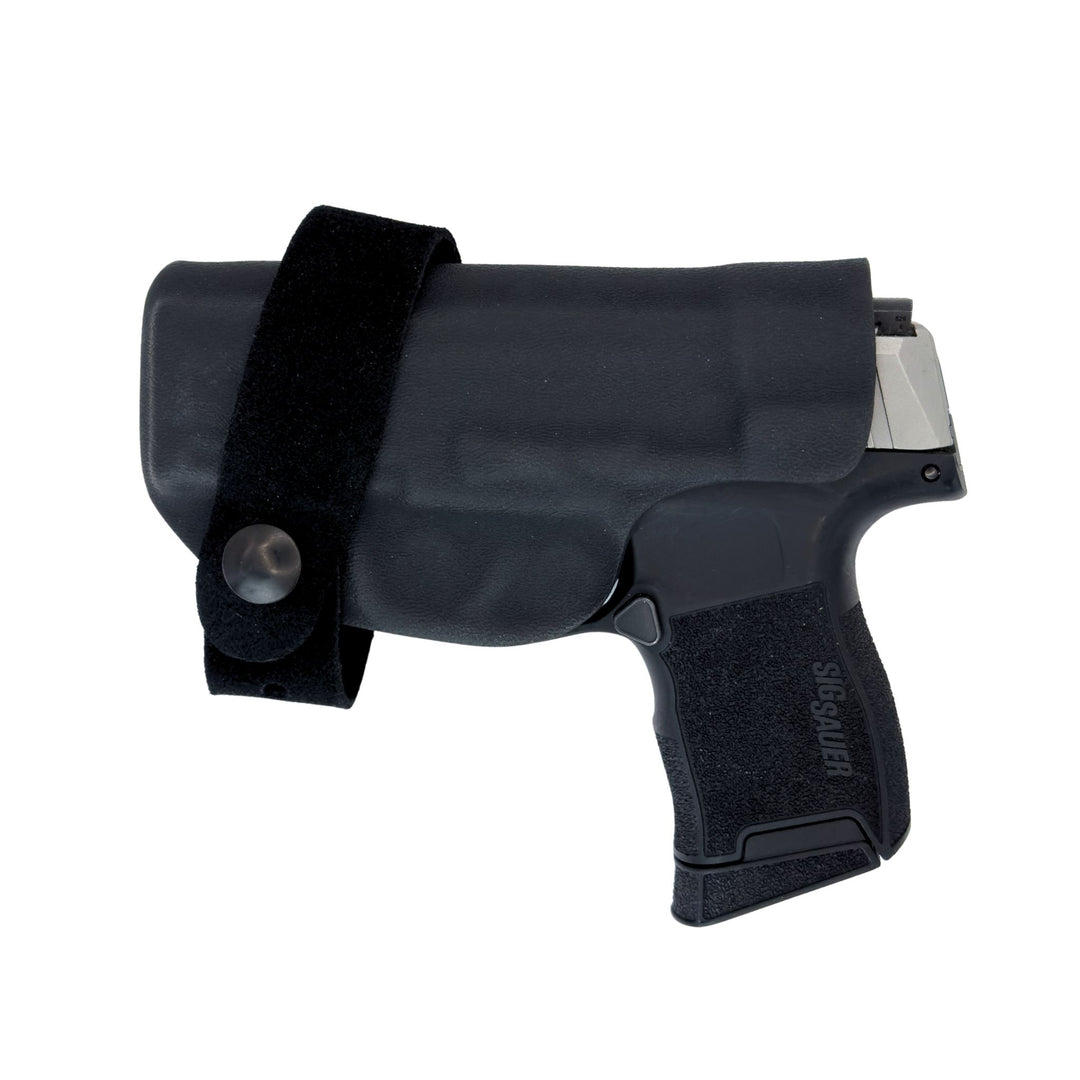 Black handgun holster with a gun on a white background