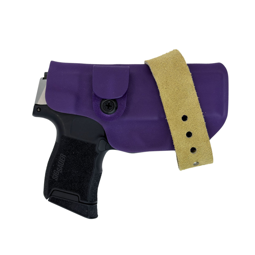 Purple gun holster with a black gun inside on a white background