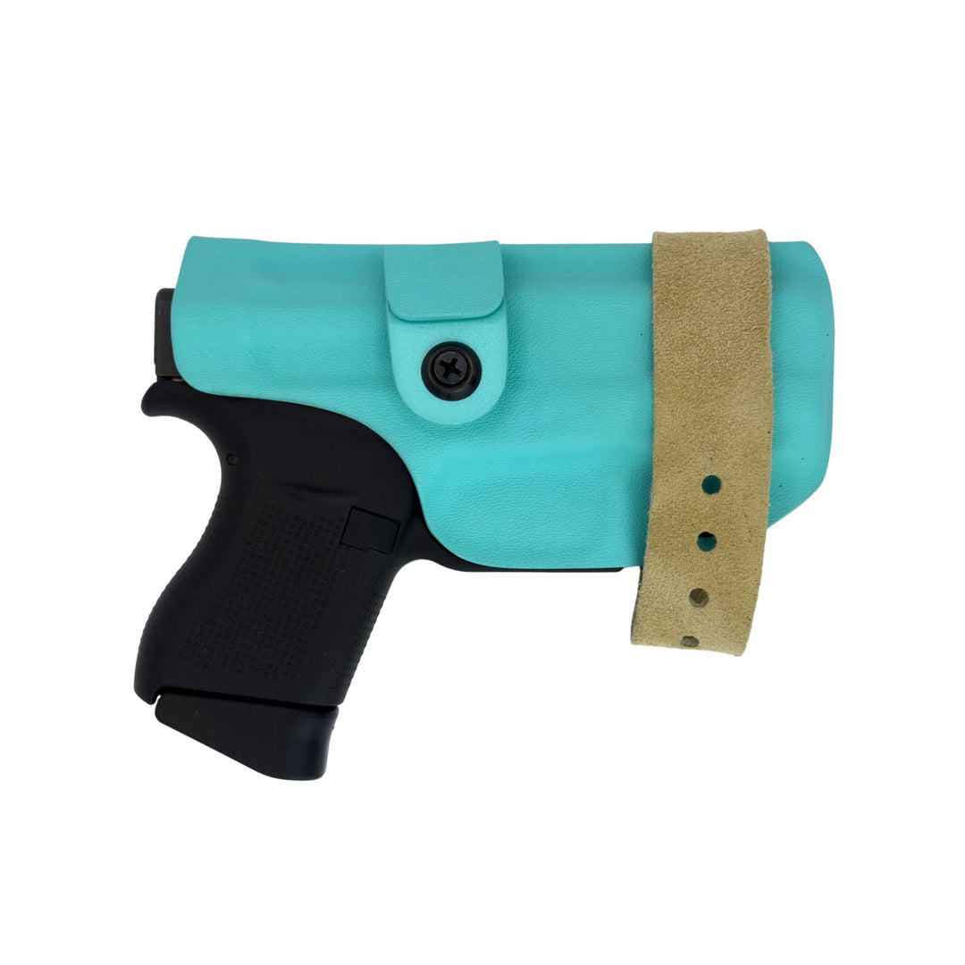 Turquoise gun holster with a black gun inside on a white background